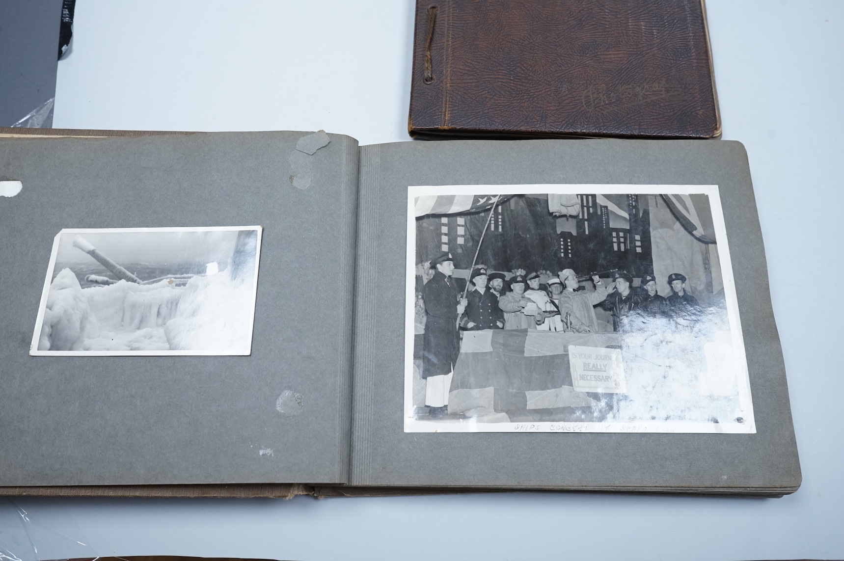 Two WWII naval photo albums, containing an archive of 1940s photographs of the Russian convoy in the Barents Sea, a ship’s concert at Scarpa Flow, a variety of Royal Naval vessels and some aircraft, images aboard HMS Peg